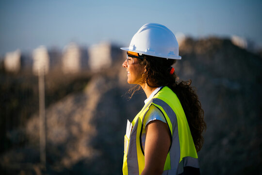 Female construction worker in hard hat and safety vest
