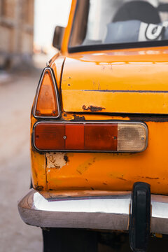 Close-up of vintage Soviet car tail light with rust
