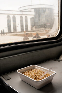Instant noodles meal on train window table in Uzbekistan