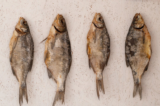 Dried taranka fish snack from Uzbekistan on light background