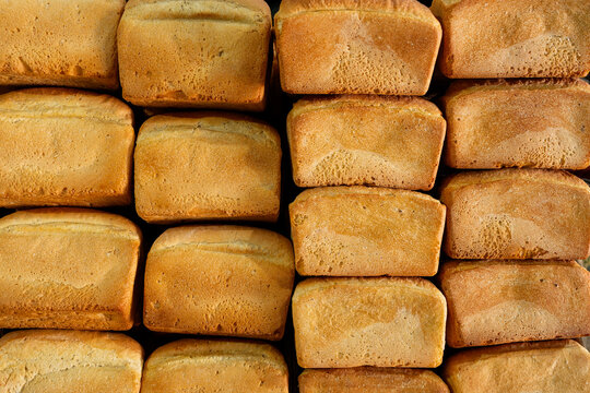 Close-up of stacked Uzbek bread loaves at market stall