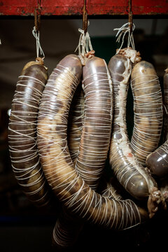 Traditional Uzbek sausages hanging to dry in a bazaar