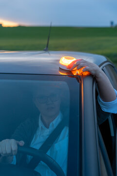 V16 emergency beacon on car roof for roadside warning