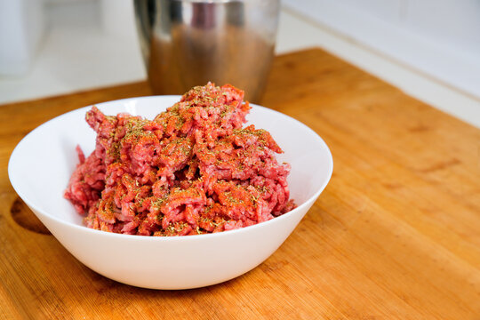 Bowl of seasoned ground beef for homemade burgers