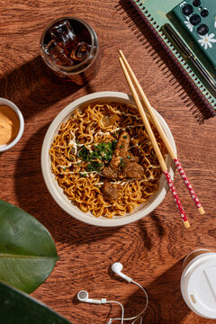 Take away noodle bowl with chicken, mayo and chives