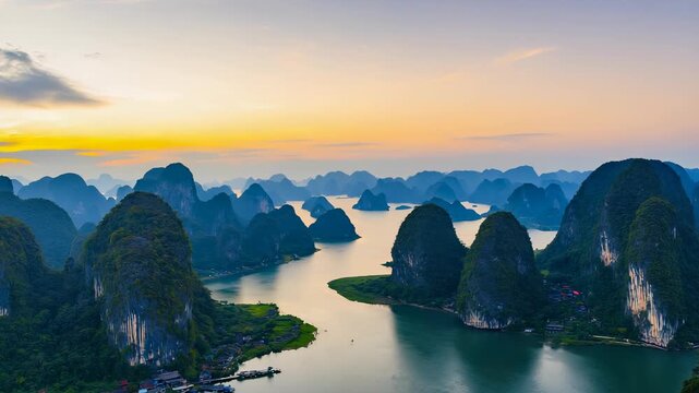 Majestic Limestone Karst Islands Rising from Emerald Waters in Halong Bay, Vietnam, at Golden Hour.