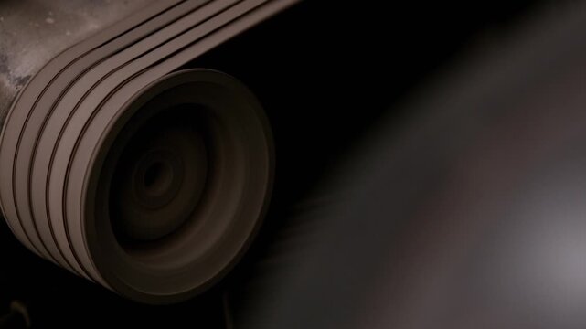 Rotating industrial wheel with dramatic spotlight