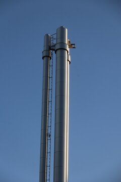 Industrial Pipes Against Blue Sky