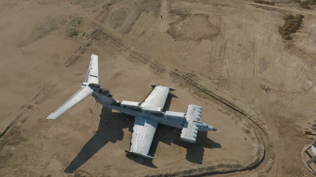 Drone footage of the abandoned Lun-class ekranoplan aircraft on a sandy shoreline near Derbent, Republic of Dagestan, Russia, by the Caspian Sea