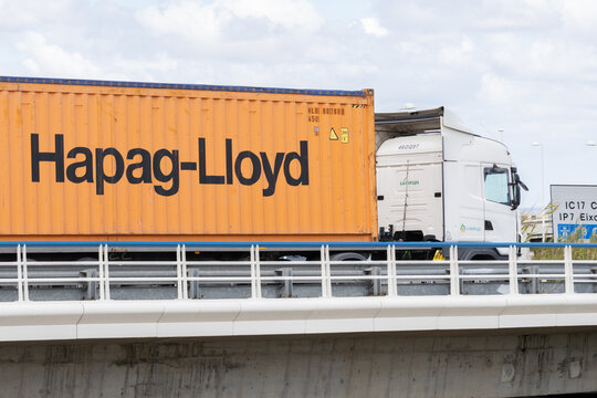 Hapag-lloyd shipping container truck driving on bridge