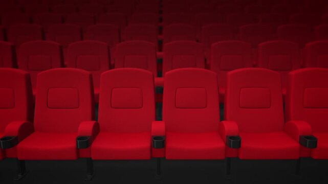 Movie theater hall with red armchairs rows. Cinema with camera motion. 4K video
