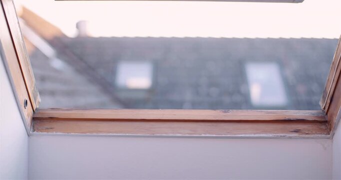 Rainy skylight above a quiet interior