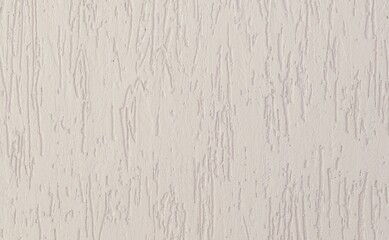 Fototapeta premium Decorative stucco wall background texture pattern. Light peach color wall