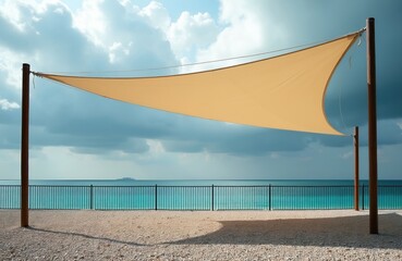 Obraz premium Beach canopy shades sand beach. Turquoise ocean water, cloudy sky, calm sea. Remote island on horizon. Peaceful seaside resort, vacation destination.