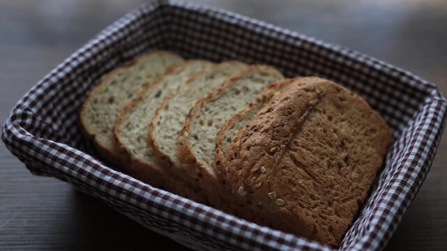 Close-up of sliced healthy oat diet bread topped with grains