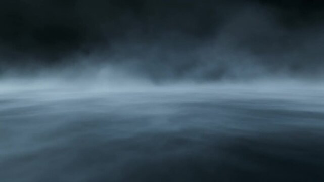 A serene natural landscape with fog rolling over the ocean at dusk