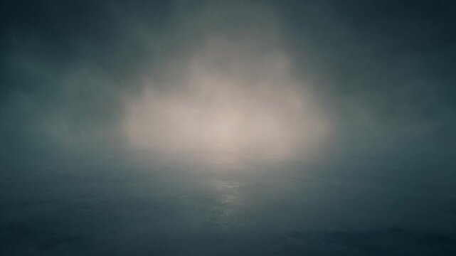 A glowing light shines through the dark cloudy sky at nighttime.