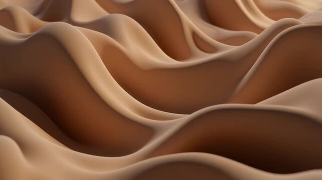 Sand dunes undulate in desert landscape with smooth brown hills