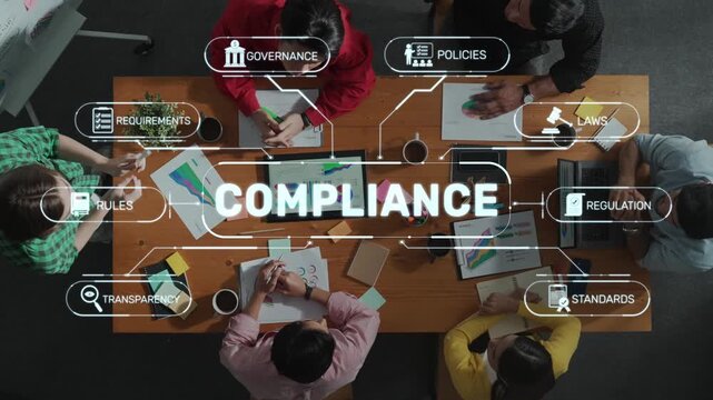 A diverse group of professionals collaborates on compliance strategies in an engaging office setting. Technology and planning come together for impactful decision-making. Raster