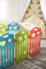 Beautiful playpen and wigwam in child's room, closeup © New Africa