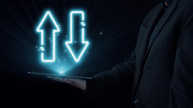 A businessman holds a digital tablet showcasing glowing arrows indicating increased quality and reduced cost, representing effective strategies for business improvement. Qubit