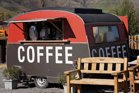Vintage coffee caravan serving refreshments in a rural New Zealand setting.
