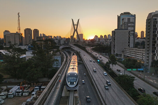 Monorail train in S&atilde;o Paulo with the Oct&aacute;vio Frias de Oliveira Bridge in the background - S&atilde;o Paulo, Brazil