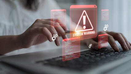Woman Hands on Laptop Keyboard with System Warning Alert and Digital Interface Displaying Error...