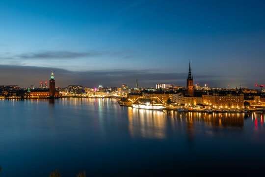 Stockholm Skyline Reflections Across Blue Hour Waterfront