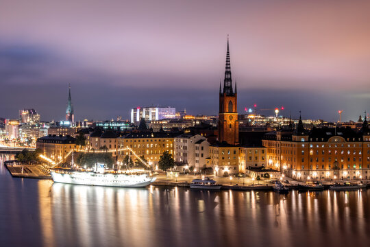 Stockholm Skyline Reflections Across Blue Hour Waterfront