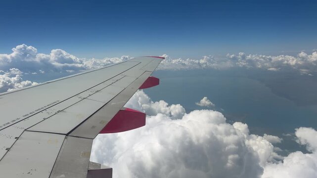 Airplane Wing Above Clouds