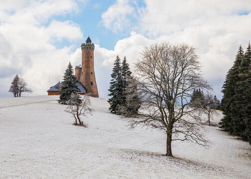 Fichtelberg tower standing on snowy mountain landscape in winter