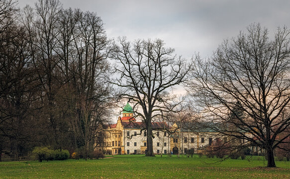 Chateau park with historic building and bare trees