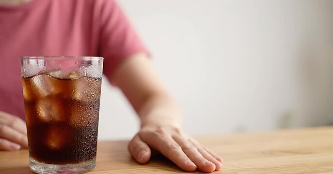 Woman Refuses Sugary Soda, Choosing Healthy Lifestyle Over Unhealthy Drinks.