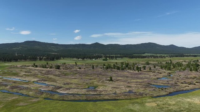Aerial of swampy Phillips Lake in Sumpter Valley Oregon in spring time
