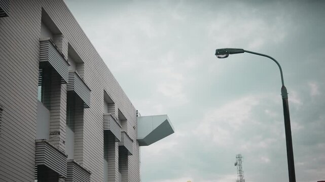 Modern Office Building Exterior with Street Lamp in Urban Business District