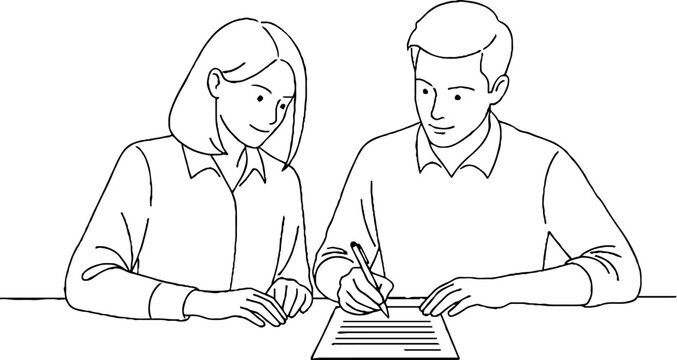 Two colleagues reviewing important documents together at desk.
