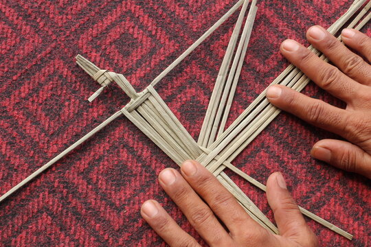 The process of making suket puppets, which are made from a type of grass called mendong