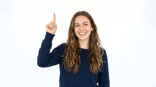 Young woman with long curly hair smiling and pointing her index finger upwards indicating an idea or a solution PNG Isolated on transparent background