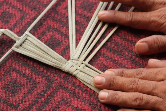 The process of making suket puppets, which are made from a type of grass called mendong