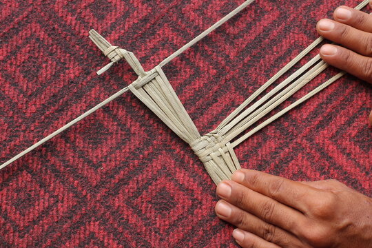 The process of making suket puppets, which are made from a type of grass called mendong