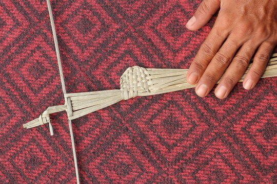The process of making suket puppets, which are made from a type of grass called mendong