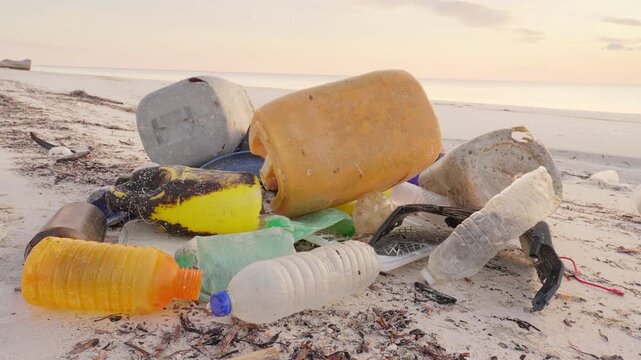 plastic waste or trash on beach sand, ocean or sea pollution, indonesia, southeast asia, stop motion