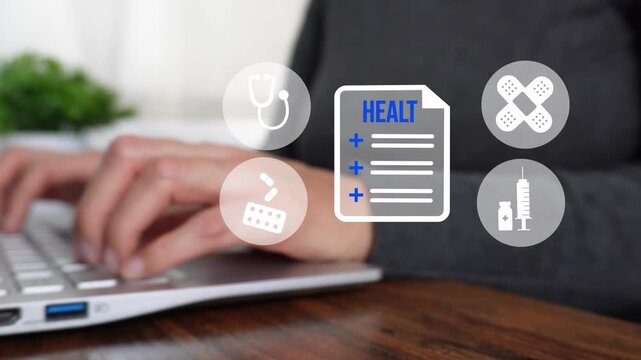 Close-up of a woman's hand working on a computer while pointing to an animation of healthcare symbols surrounding a central health document.