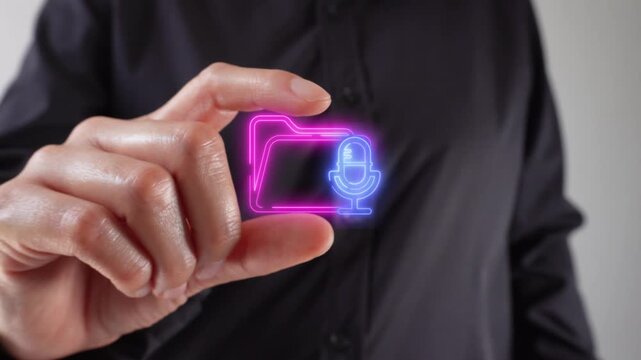 Audio folder. Close-up of a woman's hands holding a virtual folder icon between her two fingers.