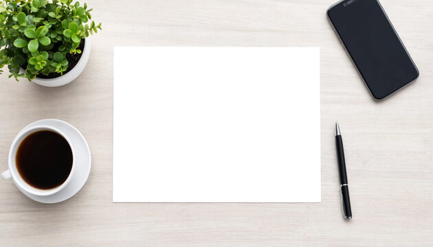 Top view of a blank paper sheet with coffee cup, plant and smartphone