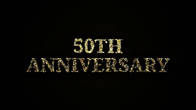 Golden particles forming 50th Anniversary text glittering black background