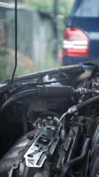 car mechanic changing car engine