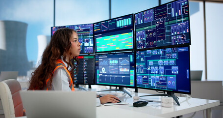 Young Hispanic Woman Engineer Is Checking Nuclear Plant Control © Andrey Popov