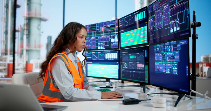 Young Female Engineer Using Computer Screens